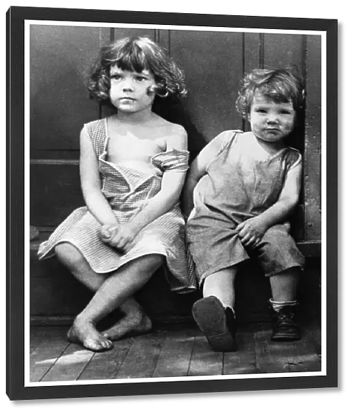 POVERTY: CHILDREN, 1935. Two impovished children in the slum section of Georgetown, Washington, D