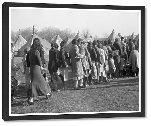 ARKANSAS: REFUGEES, 1937. Flood refugees in line for a meal at the camp at Forrest City