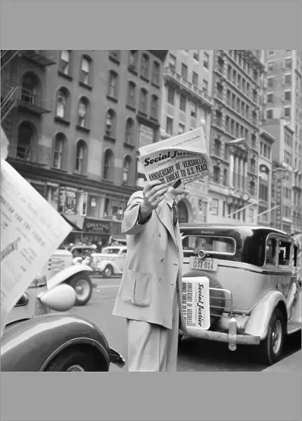 NEW YORK CITY, 1939. A vendor selling Social Justice, an anti-Semitic periodical