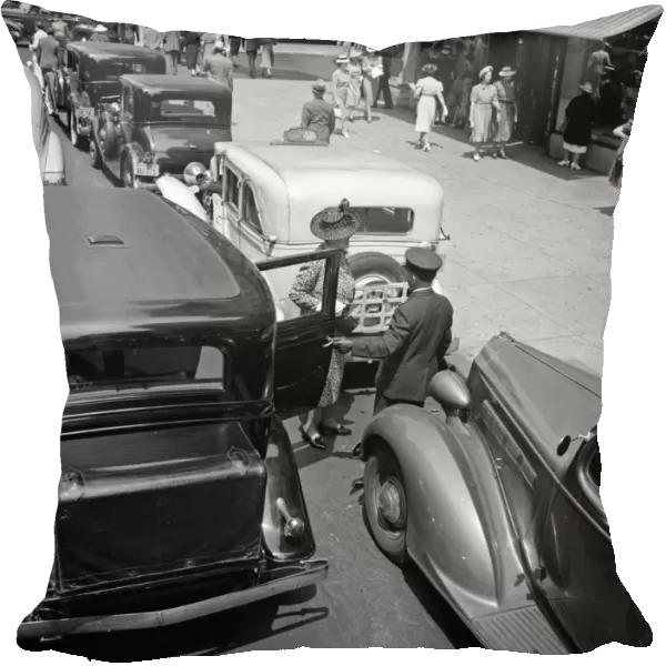 NYC: FIFTH AVENUE, 1939. A woman exiting a private limousine on 5th Avenue near