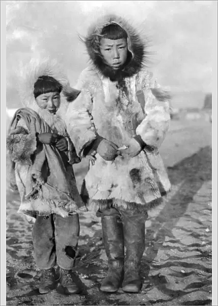 ALASKA: ESKIMOS. Two young Eskimo boys dressed in traditional fur clothing, Nome, Alaska