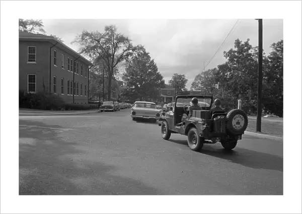 INTEGRATION: OLE MISS, 1962. A military jeep escorting the car carrying James Meredith