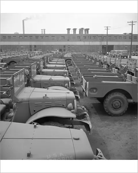 DETROIT: FACTORY, 1942. Newly assembled Army trucks at the Chrysler Corporation plant in Detroit