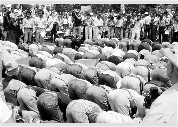IRANIAN HOSTAGE CRISIS, 1980. Iranian men bowing in prayer at a demonstration in Washington, D