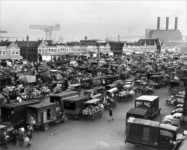 BROOKLYN: MARKET, 1940. A crowd of trucks and horse-drawn carts at Wallabout Market in Brooklyn