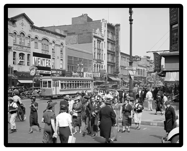 NEW YORK CITY, 1938. Street scene on 125th Street and 7th Avenue in New York City
