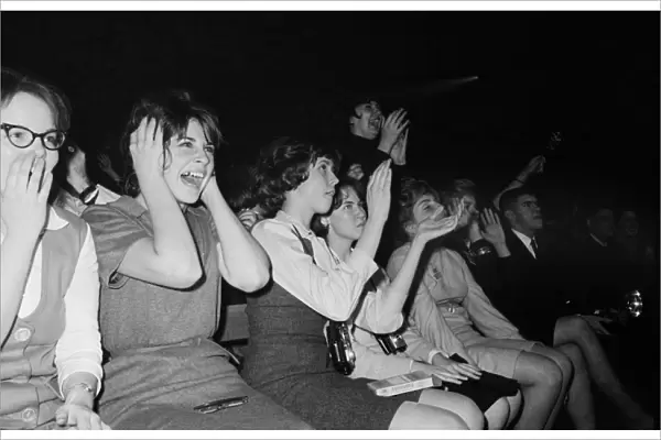 THE BEATLES, 1964. Fans screaming during the Beatles concert at the Washington