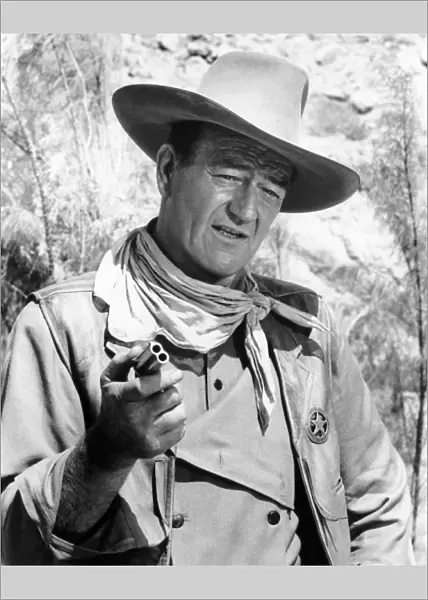 JOHN WAYNE (1907-1979). American actor. Wayne in a scene from The Comancheros