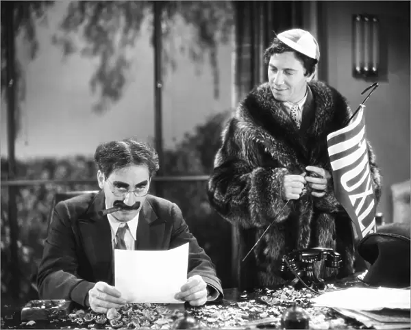 THE MARX BROTHERS, 1932. Groucho (left) and Chico Marx in Horse Feathers, 1932