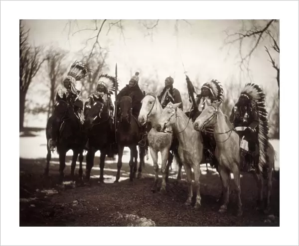 NATIVE AMERICAN CHIEFS. Six tribal chiefs, in ceremonial attire. Left to right: Little Plume (Piegan), Buckskin Charley (Ute), Geronimo (Chiricahua Apache), Quanah Parker (Comanche), Hollow Horn Bear (Brul Sioux) and American Horse (Oglala Sioux). Photograph by Edward S. Curtis, c1900