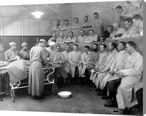 ALEXIS CARREL (1873-1944). French surgeon and physiologist. Carrel (in white cap) demonstrating before a group of surgeons at the Rockefeller Institute War Demonstration Hospital in New York during World War I
