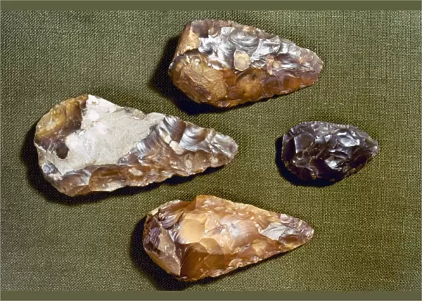PALEOLITHIC TOOLS. Hand axes chipped from flint nodules, c200, 000 B. C. found at London, England