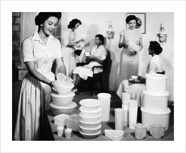 TUPPERWARE PARTY, 1950s. A Tupperware party in an American home. Advertising photograph, 1950