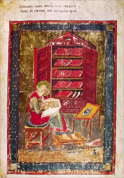 CODEX AMIATINUS: EZRA. Ezra the scribe writing in a large codex held on his knees. Illumination from the Codex Amiatinus, Northumbria, early 8th century