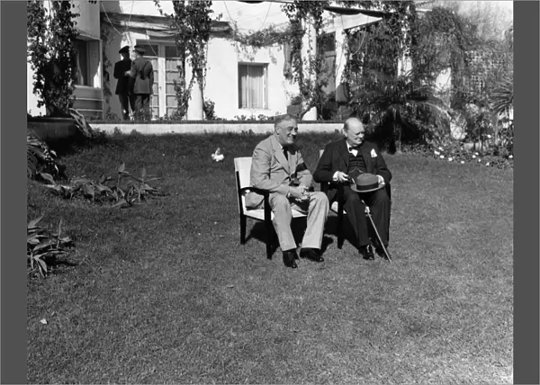 President Franklin D. Roosevelt of the United States and Prime Minister Winston Churchill of Great Britain (right) photographed on the lawn of the Hotel Anfa in Casablanca, Morocco, during the Casablanca Conference, January 1943