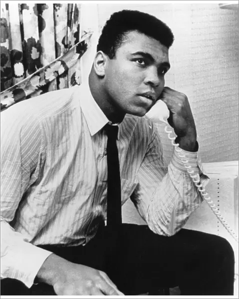 MUHAMMAD ALI (1942- ). NÔÇÜ Cassius Clay. American heavyweight boxer. Ali talking on the phone in Houston, Texas, 1967