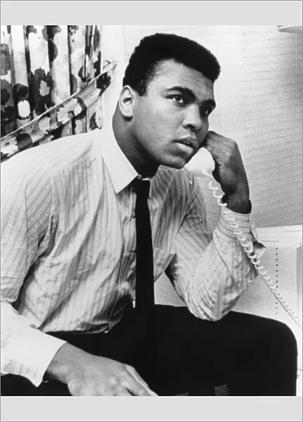 MUHAMMAD ALI (1942- ). NÔÇÜ Cassius Clay. American heavyweight boxer. Ali talking on the phone in Houston, Texas, 1967