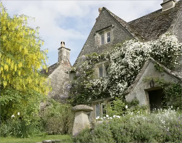 Calmsden. A spring day in the cotswold village of Calmsden with its old farm house