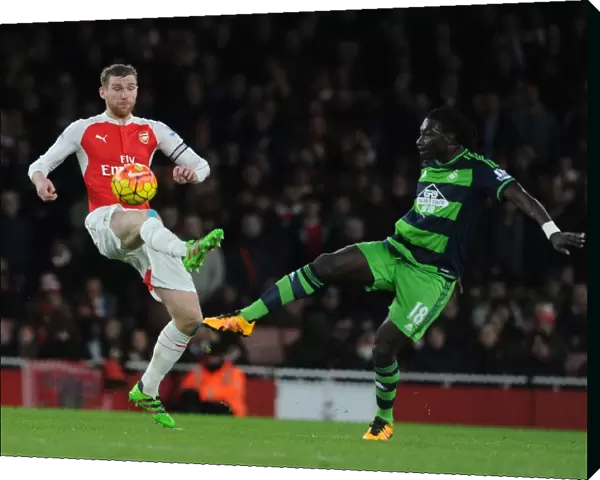 Arsenal vs Swansea Clash: Mertesacker vs Gomis Battle at Emirates Stadium