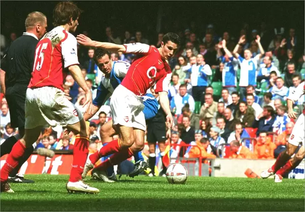Robin van Persie (Arsenal) turns Lucas Neill (Rovers) on his way to scoring Arsenals 2nd goal h