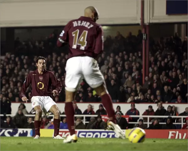 Thierry Henry delfects a shot by Robert Pires into the goal for Arsenals 1st goal
