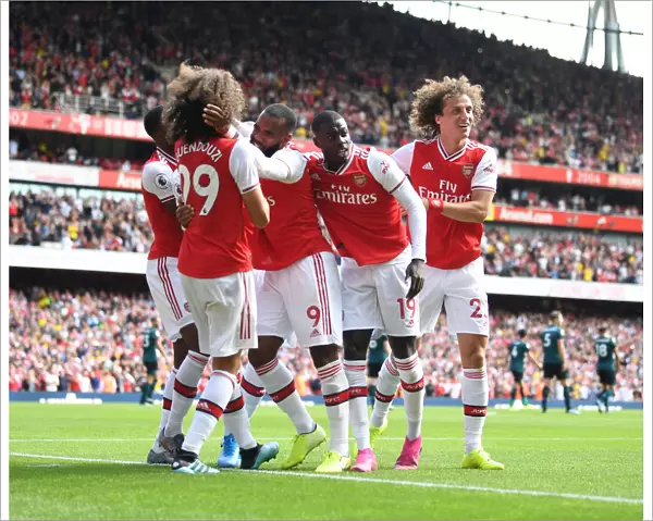 Arsenal's Stars: Guendouzi, Lacazette, Pepe, and Luiz Celebrate Second Goal vs. Burnley (2019-20 Premier League)