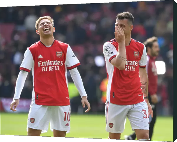 Arsenal's Smith Rowe and Xhaka Celebrate Victory Over Manchester United in 2021-22 Premier League