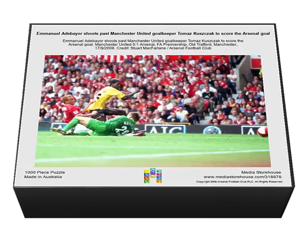Emmanuel Adebayor shoots past Manchester United goalkeeper Tomaz Kuszczak to score the Arsenal goal