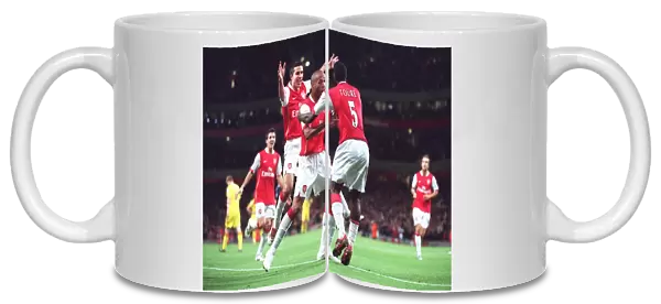 Arsenal's Unforgettable Triumph: Toure, Henry, and van Persie Celebrate a 3:0 Victory Over Liverpool