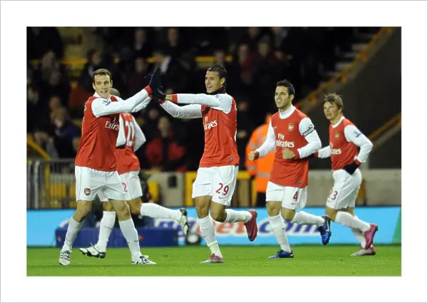 Chamakh and Squillaci: Arsenal's Unstoppable Duo Celebrates First Goals in 10-11 Premier League Win Against Wolverhampton