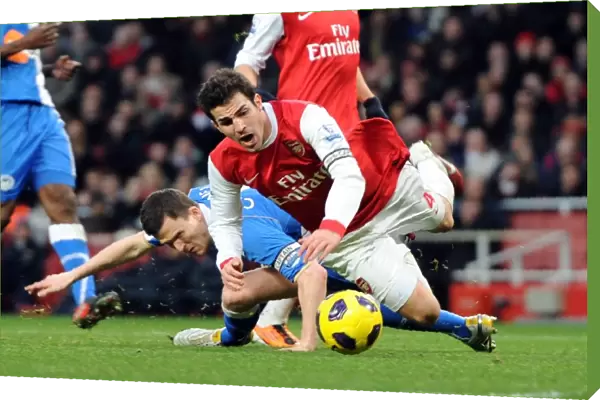Cesc Fabregas (Arsenal) is fouled by Gary Caldwell (Wigan) for the Arsenal penalty