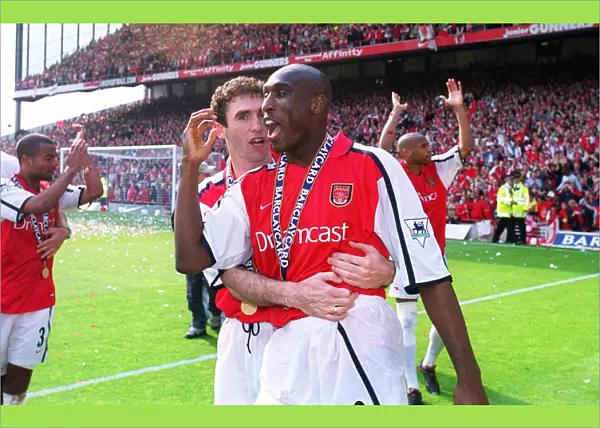 Arsenal defenders Martin Keown and Sol Campbell celebrate after the match