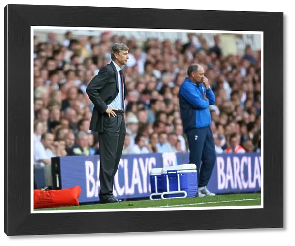 Arsenal manager Arsene Wenger and Tottenham manager Martin Jol during the match
