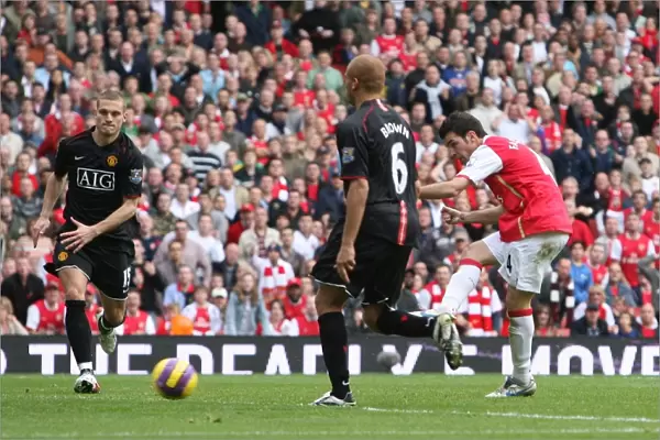 Cesc Fabregas shoots past Edwin van der Sar to score the 1st Arsenal goal