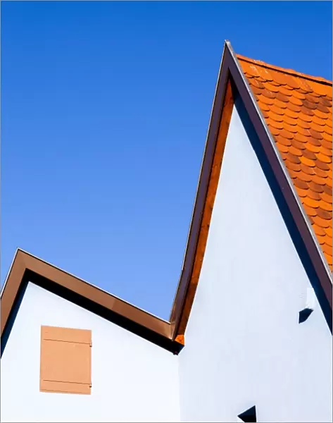 The roofline of a house in Gertwiller, France