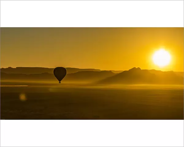A hot-air balloon at sunrise in the Namib Naukluft area of Namibia