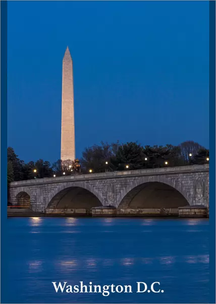Memorial Bridge at dusk spans Potomac River and features Washington Monument