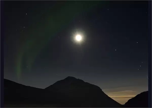 A glimpse of Northern Lights on a winter night in Iceland, with moon 4