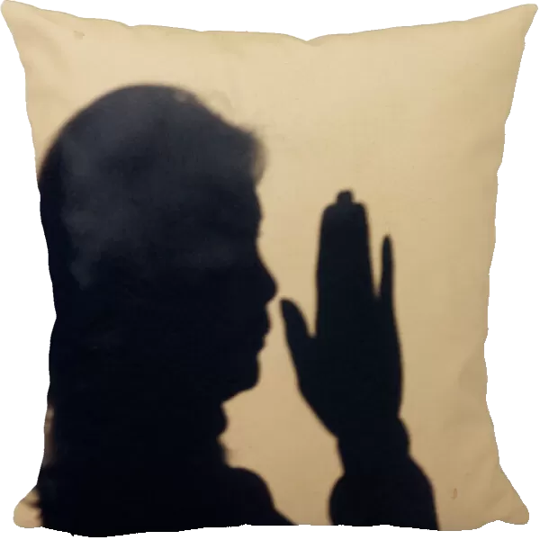 Silhouette of a woman praying. Concept for religion, faith, prayer and spirituality