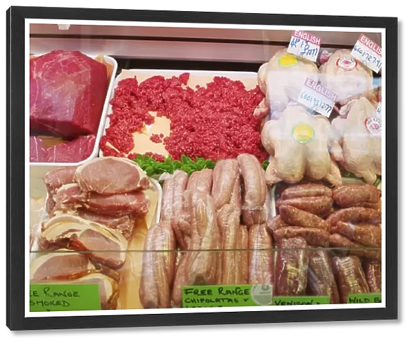 Free range poultry, sausages, minced meat and various other cuts of meat arranged in meat display case