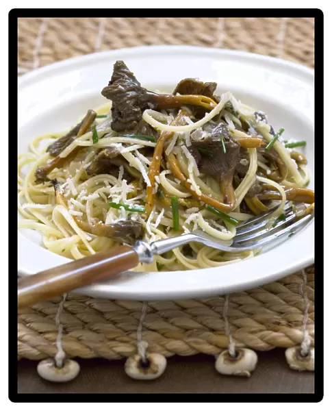 Linguini pasta with trumpet chanterelle mushrooms and grated cheese