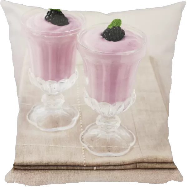 Glasses of blackberry fool, close-up