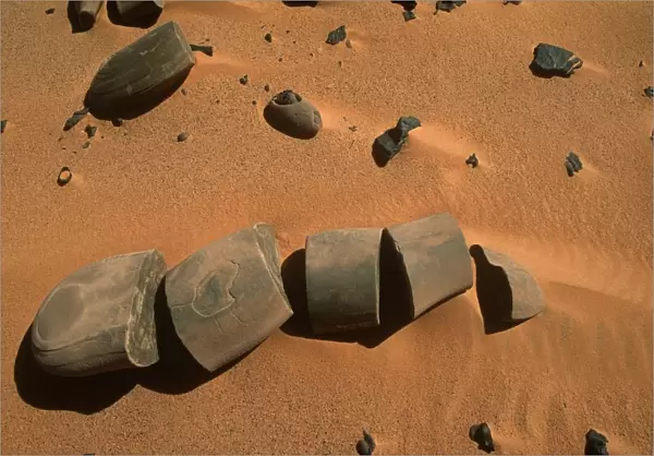 Egypt, Western Desert, Libyan Desert, Gilf Kebir, Broken stones in brown-colored soil