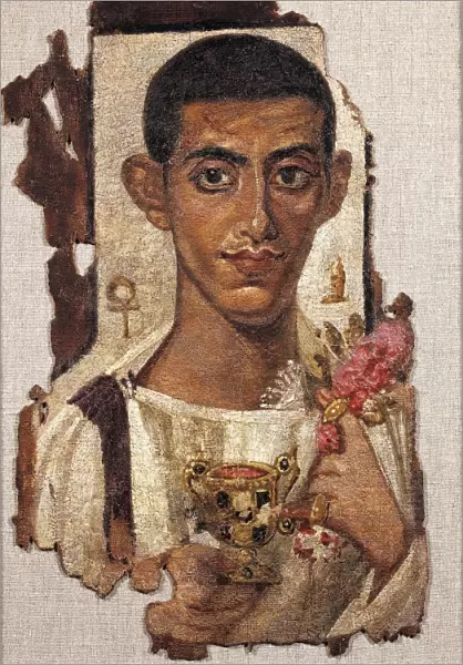 Egyptian civilization, Portrait of young man holding ciborium and flowers, Distemper painting on wood, From Al Fayyum, Egypt