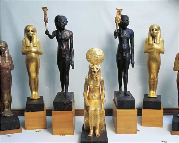 Statuettes of Tutankhamen as god Thy, wood statuettes of sistrum players and gold statuettes of deities, from Valley of the Kings, tomb of Tutankhamen