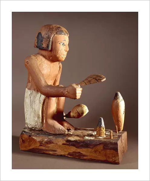 Egypt, Asyut, Statuette representing a cook trying to roast a duck, coloured plastered wood