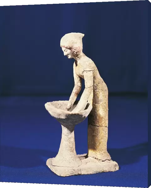 Clay figurine of woman kneading