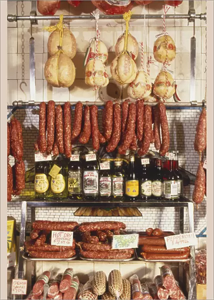 USA, New York, Manhattan, Little Italy, selection of smoked meats, sausages and olive oils in Italian delicatessen
