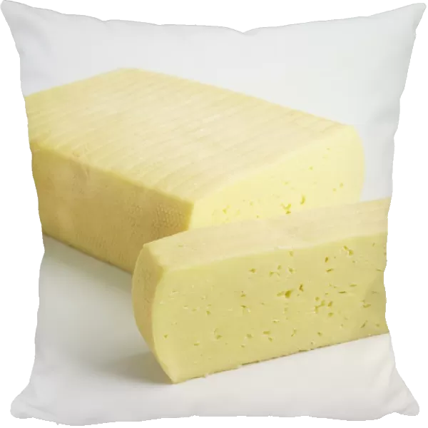 Sliced brick of Danish Esrom PGI cows milk cheese