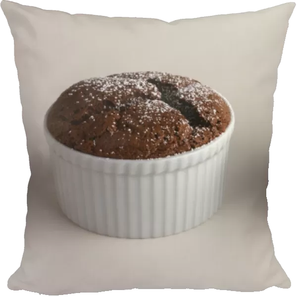 Front view of Baked Chocolate Puds with Icing Sugar being sprinkled on them